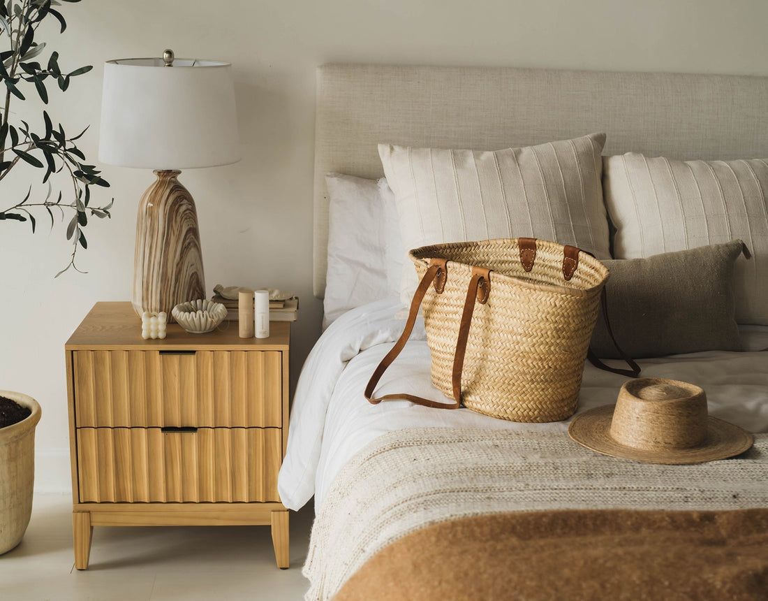 Image of packed beach bag and hat on the bed