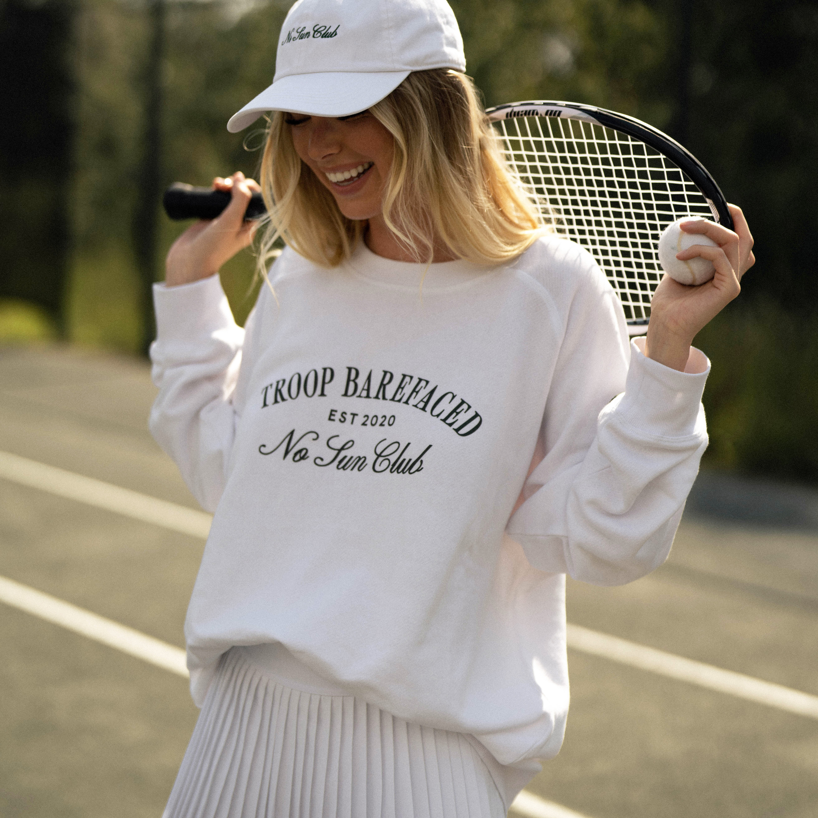 Woman wearing No Sun Club Crewneck sweatshirt